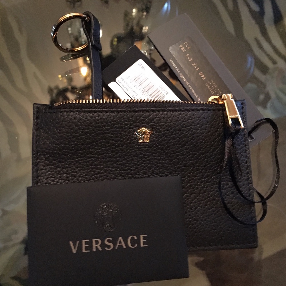 Gold Medusa. Black leather zip wallet w/key ring.